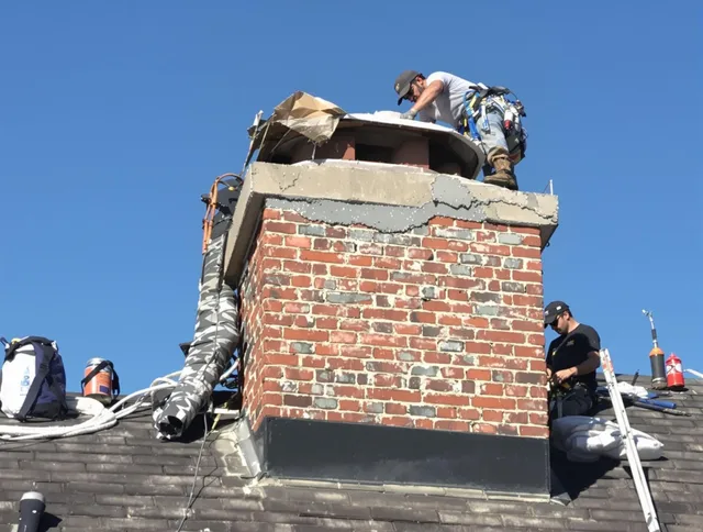 Temple City Chimney Sweep installing a custom chimney crown in Temple City, CA